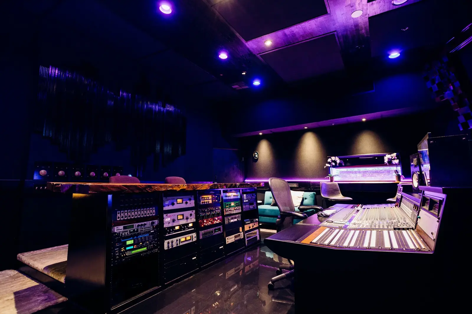 Studio A's large mixing console and lounge seating